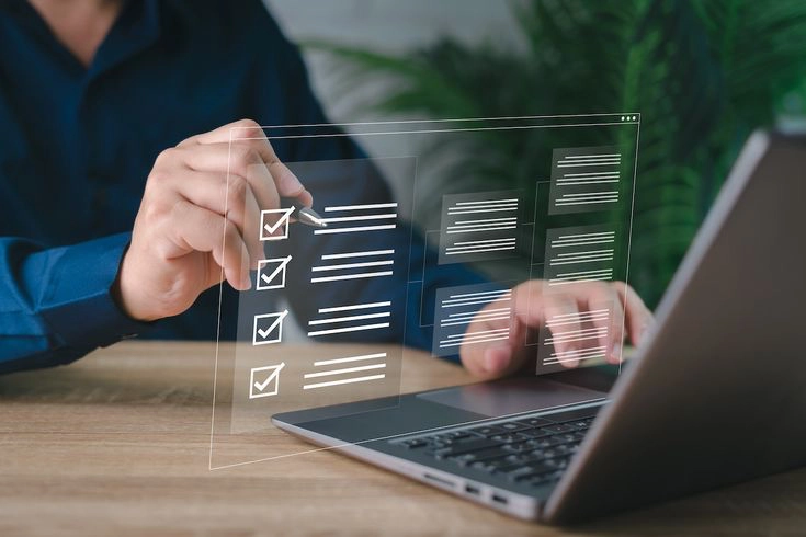 person reviewing social media strategy on a laptop, highlighting common social media mistakes that hurt business growth and online engagement.